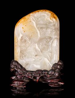 A Chinese Carved Jade Boulder Height of jade 4 1/2 in., 14.5 cm.