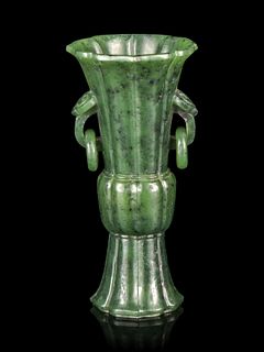 A Carved Spinach Jade Gu Vase
Height 3 7/8 in,. 8 cm. 