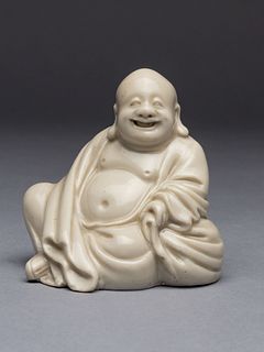 A Blanc-de-Chine Porcelain Figure of Budai BuddhaOverall height 2 1/2 in., 6.4 cm.