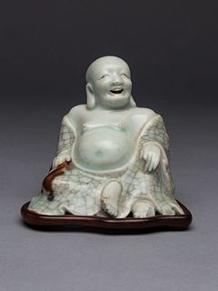 A Qingbai Glazed Porcelain Figure of Budhai BuddhaHeight 3 1/4 in., 8.3 cm.