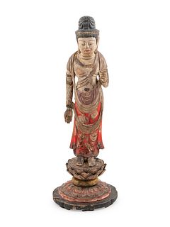 A Japanese Carved and Polychrome Lacquered Wood Standing Buddha
Height 26 1/2 in., 67.3 cm.