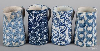 Four blue spongeware pitchers, 19th c.
