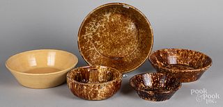 Four Rockingham and yellowware bowls, etc.