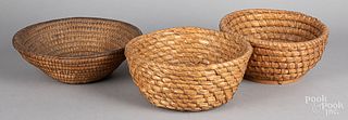 Three rye straw baskets