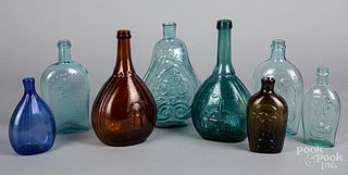 Colored glass bottles and historic flasks