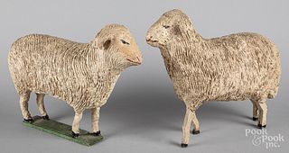 Two large carved and gessoed stick leg sheep