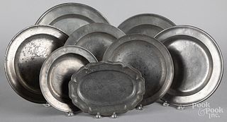 Eight pewter chargers and trays