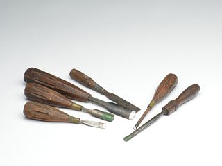 Six old wood carving chisels.