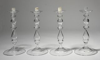 Four large Steuben glass baluster teardrop candlesticks