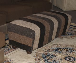 Striped wool upholstered ottoman on ball feet