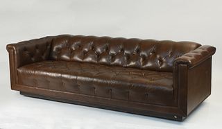 Tufted brown leather sofa