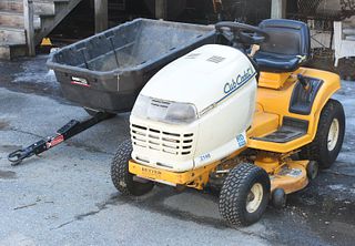 Cub Cadet riding mower with pull behind cart