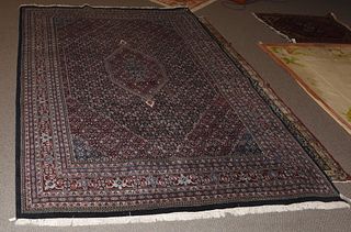 Roomsize Oriental rug, black and maroon