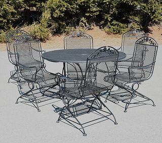 Wrought iron patio set table and six armchairs