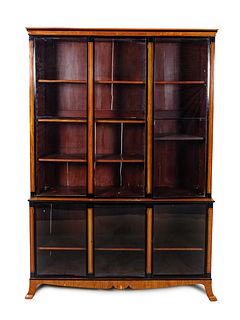 A Biedermeier Parcel Ebonized Elmwood Breakfront Cabinet