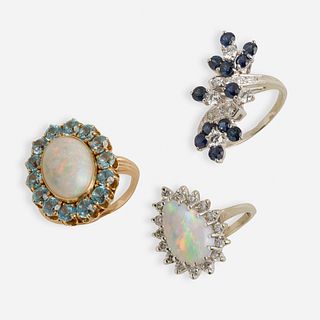 Two opal rings and a sapphire and diamond ring