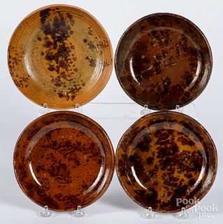 Four Pennsylvania redware shallow bowls