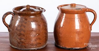 Two Pennsylvania redware lidded pitchers