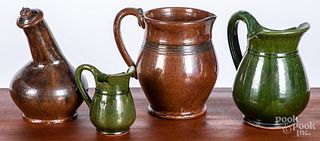 Three Stahl redware pitchers, etc.