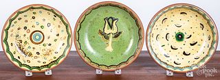 Three Isaac Stahl redware shallow bowls