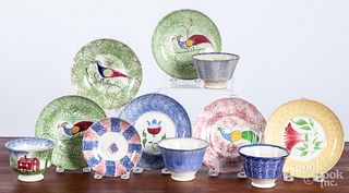 Group of mismatched spatter cups and saucers