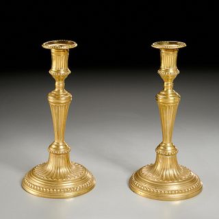 Pair signed Louis XVI gilt bronze candlesticks