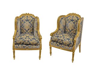 A Pair of Louis XVI Style Giltwood Bergeres a Oreilles Height 45 1/2 inches.