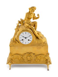 A French Empire Style Gilt Bronze Clock Height 15 inches.