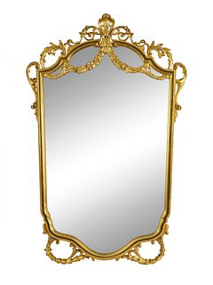 A Rococo Style Giltwood Mirror Height 53 x width 30 inches.