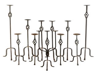 A Collection of Eleven Mizner Style Wrought Iron Candlestands Height of tallest 36 inches.