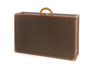 A Louis Vuitton Monogram Canvas Hardside Suitcase.