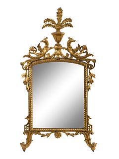 A Louis XV Style Carved Giltwood Mirror  Height 59 x width 29 1/2 inches.