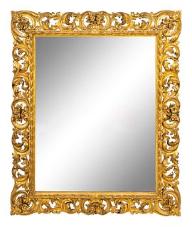 A Carved Foliate Design Giltwood Mirror Height 43 x width 36 inches.