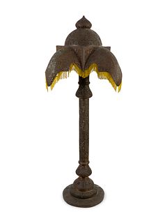 A Moroccan Pierced Brass Floor Lamp with Beaded Fringe Shade Height 75 inches.