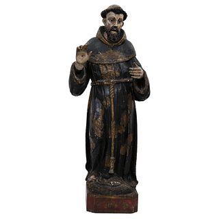 St Francis. Guatemala, 17th century. Free-standing sculpture in carved, polychrome, red and braised wood. 44.4" (113 cm) tall