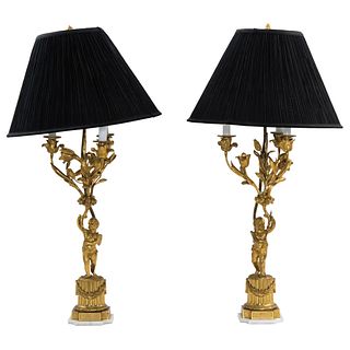Pair of Lamps. 19th Century. Golden metal decorated with plant motifs and cherubs. 33.6" (85.5 cm) tall