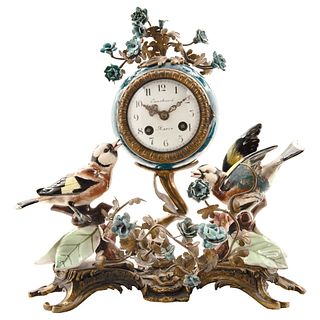 Chimney Clock. 19th century. Polychrome porcelain and metal with decorative figures of birds and flowers. 13.3" (34 cm) tall