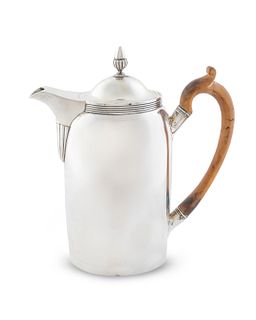 A George III Silver Coffee Pot
Height 9 x length over handle 8 1/2 inches.