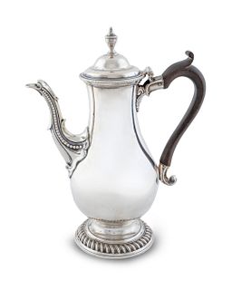 A George III Silver Coffee Pot
Height  11 3/8 x length over handle 9 1/4 inches.