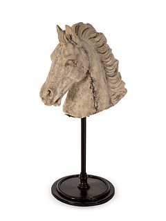 A Cast Stone Head of a Horse
Height overall 29 1/2 x diameter of base 12 inches.