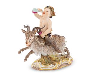 A Meissen Figure of a Bacchic Satyr Astride a Goat
Height 7 x width 6 1/2 x depth 3 1/4 inches.
