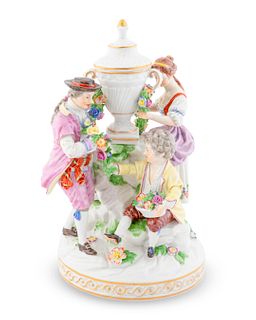 A Ludwigsburg Porcelain Figural Group: The  Flower Seller
Height 9 5/8 x diameter 6 1/2 inches.