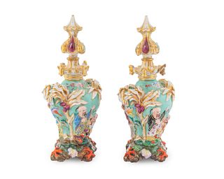 A Pair of Jacob Petit Porcelain Bottle Vases and Stoppers in the Chinese Taste
Height 12 x diameter 5 3/4 inches.
