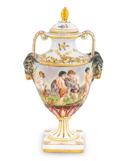 A Capodimonte Porcelain Small Vase and Cover
Height  7 3/8 x width over handles 4 1/4 inches.