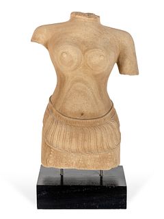 A Khmer Style Stone Torso of a Devi, Probably Uma
Height 20 inches.