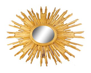 A Carved Giltwood Sunburst Mirror
Height 26 2/4 x width 34 inches.