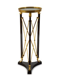 A French Empire Style Gilt Bronze and Ebonized Marble Top Pedestal Table
Height 34 1/2 x diameter 13 7/8 inches.