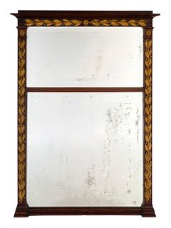 A Neoclassical Style Gilt Metal Mounted Mahogany Trumeau-style Mirror
Height 53 3/4 x width 37 1/2 inches.