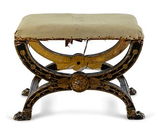 An Italian Black and Gilt Decorated Cerule Bench
Height 19 x width 26 1/2 x depth 17 1/2 inches.
