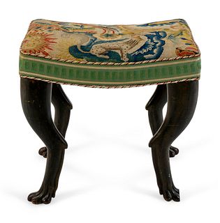 An Italian Carved and Ebonized Bench
Height 18 1/2 x width 20 x depth 15 1/2 inches.